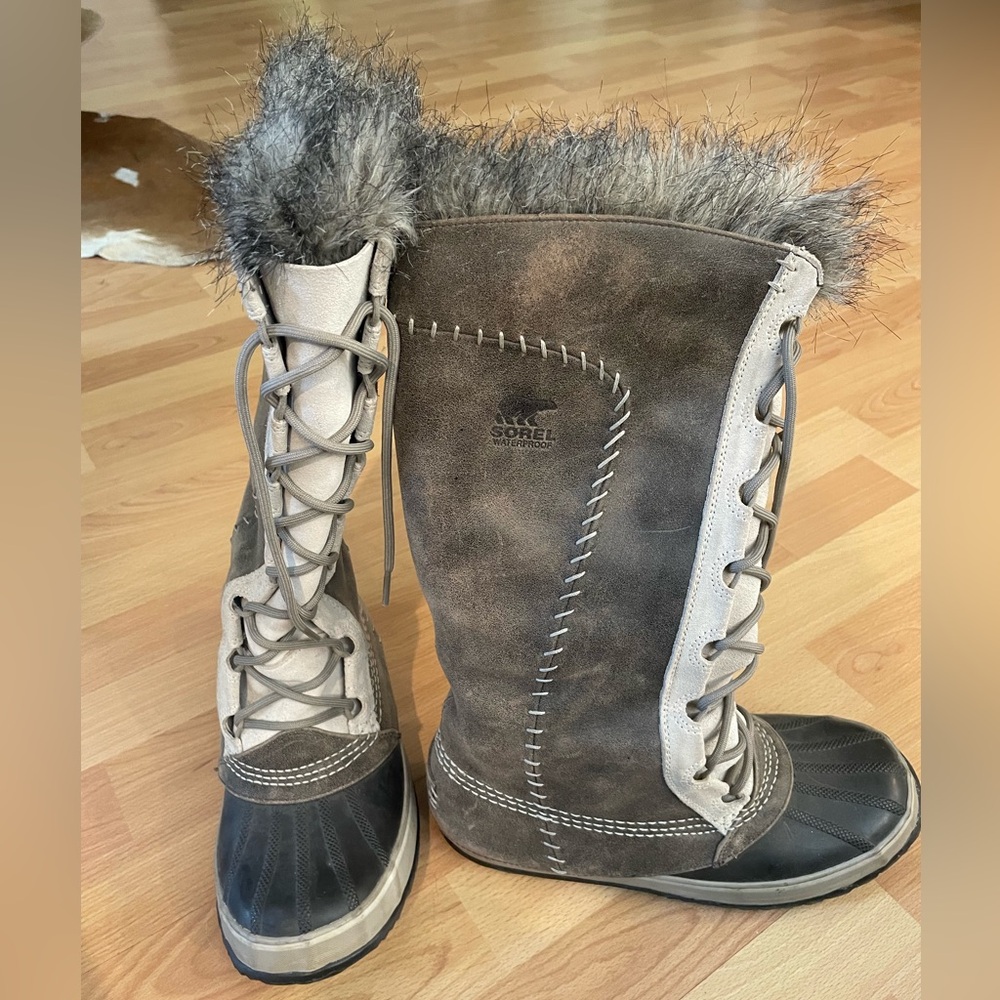 Sorel tall and insulated genuine leather lace up snow boots